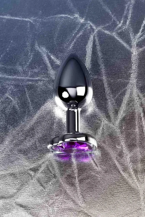 Silver anal plug with purple gem heart-shaped